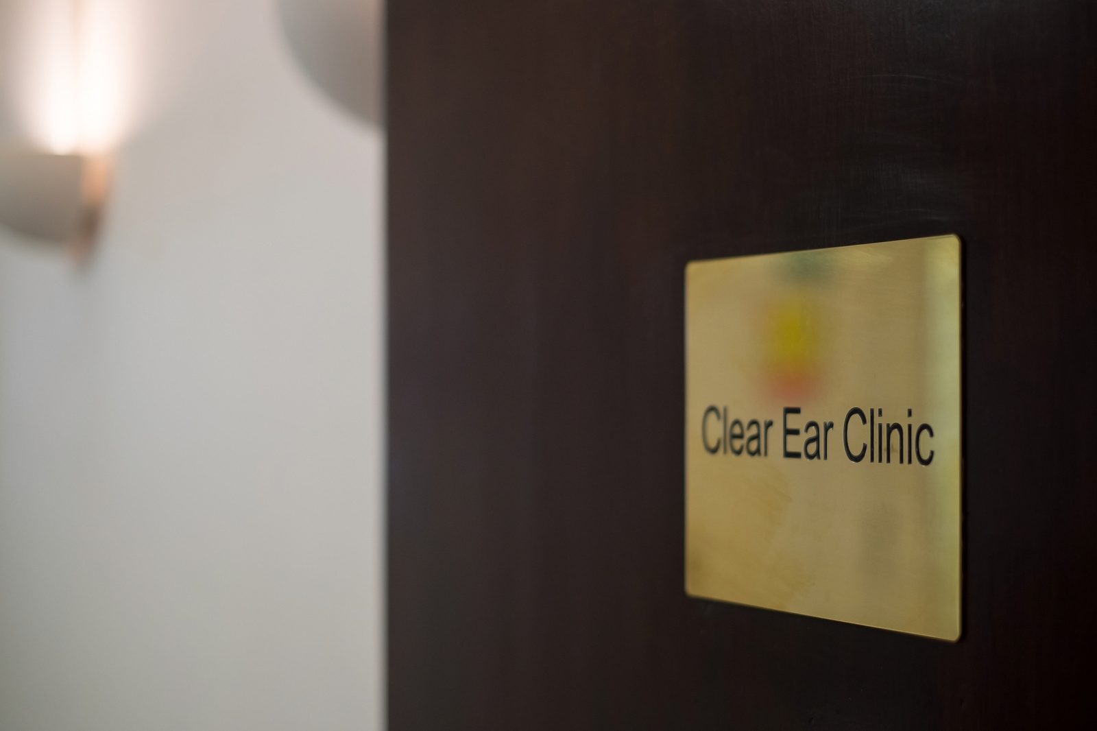 The Clear Ear Clinic plaque at the entrance to Lister House